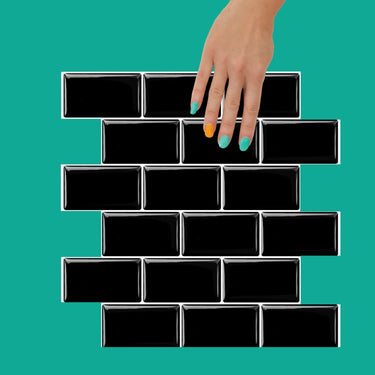 Black peel and stick subway wall tile with white grout